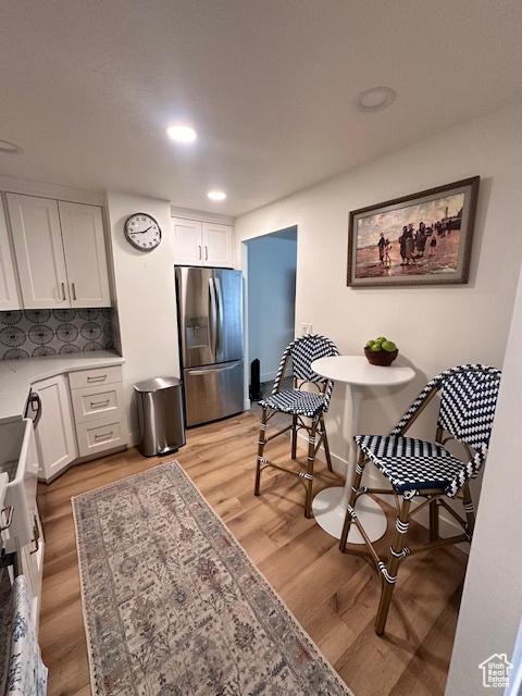 875 S Donner Way E Unit 208, Salt Lake City, UT 84108 - dining room featuring light wood-style floors and recessed lighting