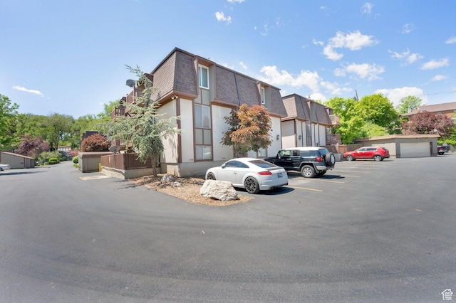 5420 Willow Ln Unit F, Murray, UT 84107 - view of building exterior featuring uncovered parking