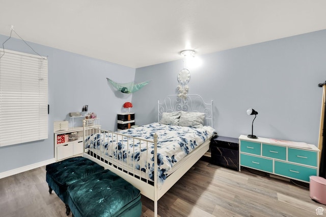 5420 Willow Ln Unit F, Murray, UT 84107 - bedroom featuring wood finished floors and baseboards