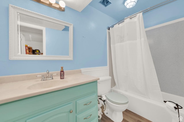 5420 Willow Ln Unit F, Murray, UT 84107 - full bath with vanity, toilet, shower / tub combo with curtain, a wainscoted wall, and wood finished floors