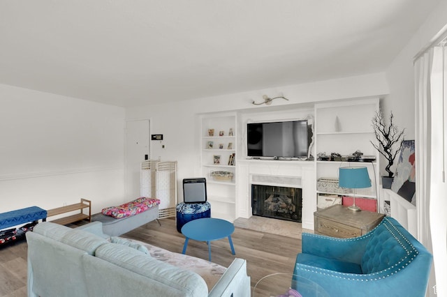 5420 Willow Ln Unit F, Murray, UT 84107 - living room featuring wood finished floors and a fireplace