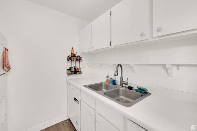 5420 Willow Ln Unit F, Murray, UT 84107 - kitchen featuring a sink, white cabinets, light countertops, dark wood finished floors, and baseboards