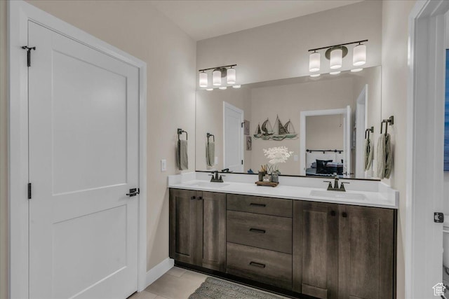 2725 E Ashwood Ln, St George, UT 84790 - bathroom with double vanity, tile patterned floors, and baseboards