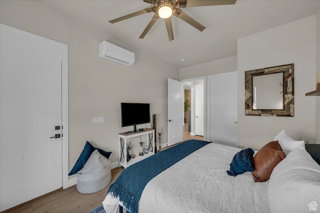2725 E Ashwood Ln, St George, UT 84790 - bedroom featuring a wall mounted AC, wood finished floors, a ceiling fan, and baseboards