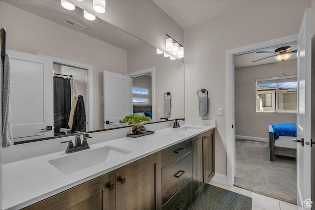 2725 E Ashwood Ln, St George, UT 84790 - full bathroom featuring double vanity, connected bathroom, baseboards, tile patterned floors, and ceiling fan