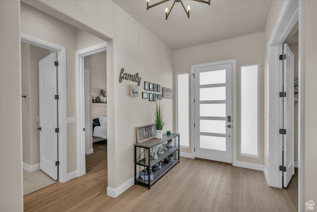 2725 E Ashwood Ln, St George, UT 84790 - entrance foyer featuring wood finished floors, baseboards, and a chandelier