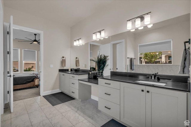 2725 E Ashwood Ln, St George, UT 84790 - ensuite bathroom featuring healthy amount of natural light, marble look tiles, two vanities, and a ceiling fan