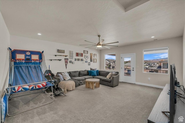 2725 E Ashwood Ln, St George, UT 84790 - carpeted living area with ceiling fan, a textured ceiling, baseboards, and recessed lighting