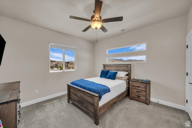 2725 E Ashwood Ln, St George, UT 84790 - bedroom with baseboards, light colored carpet, and a ceiling fan