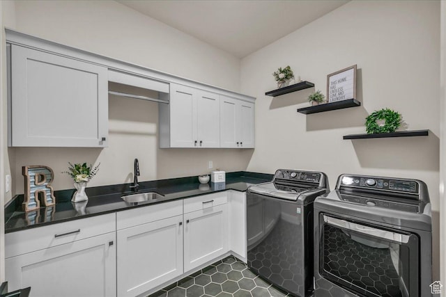 2725 E Ashwood Ln, St George, UT 84790 - laundry area with washer and dryer, cabinet space, and dark tile patterned floors