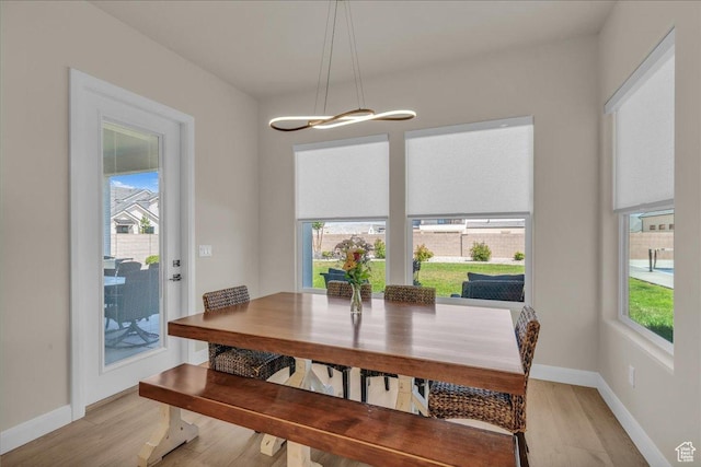 2725 E Ashwood Ln, St George, UT 84790 - dining area featuring healthy amount of natural light, light wood finished floors, and baseboards