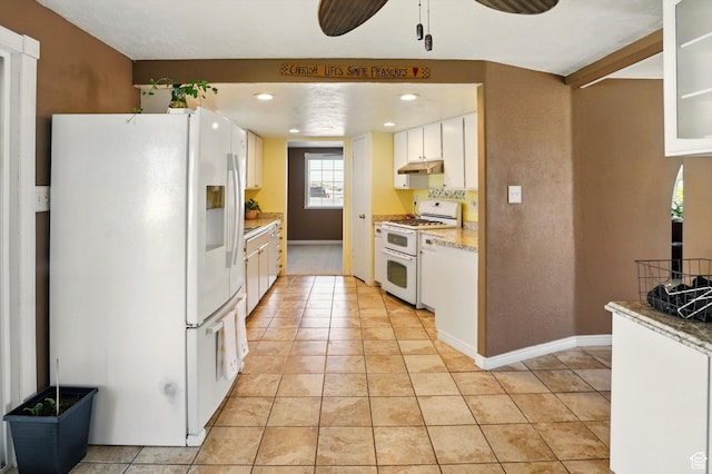 2226 W 1000 N, Tremonton, UT 84337 - kitchen featuring white appliances, under cabinet range hood, light tile patterned floors, white cabinets, and light countertops
