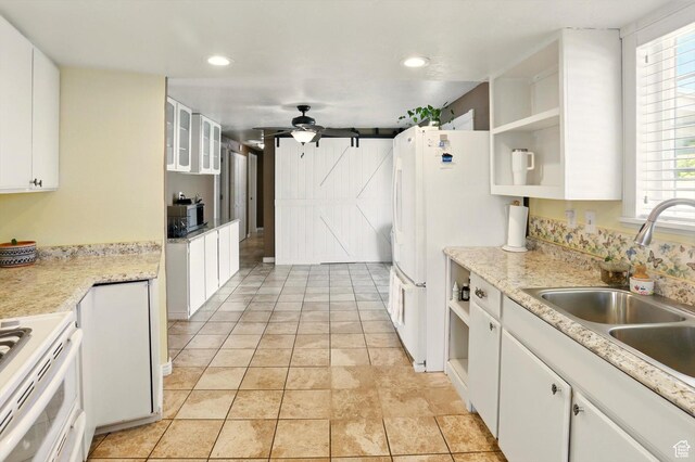 2226 W 1000 N, Tremonton, UT 84337 - kitchen with open shelves, a sink, white appliances, a ceiling fan, and white cabinets