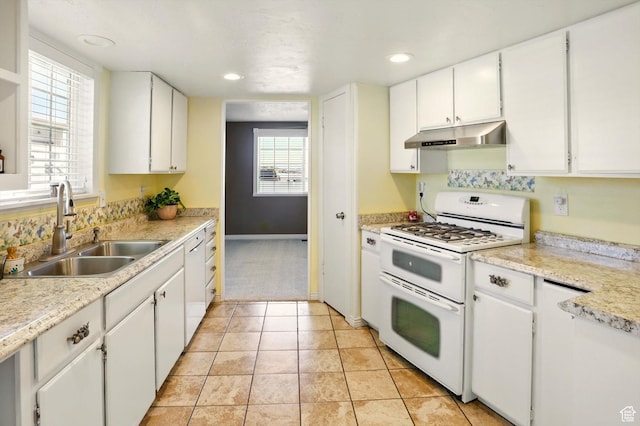 2226 W 1000 N, Tremonton, UT 84337 - kitchen featuring range with two ovens, a sink, under cabinet range hood, white cabinets, and recessed lighting