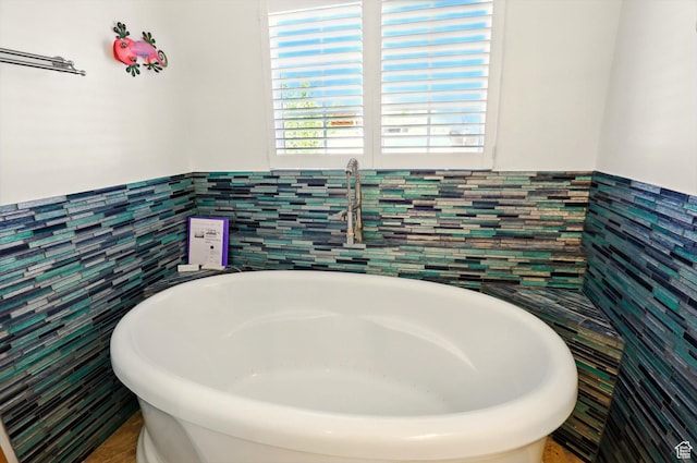 2226 W 1000 N, Tremonton, UT 84337 - full bathroom featuring tile walls, a soaking tub, and wainscoting