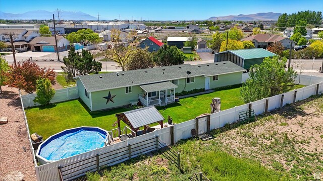 2226 W 1000 N, Tremonton, UT 84337 - aerial perspective of suburban area with mountains and a pool area