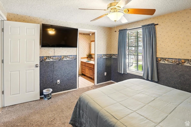 2226 W 1000 N, Tremonton, UT 84337 - bedroom featuring wallpapered walls, a textured ceiling, light colored carpet, wainscoting, and ceiling fan