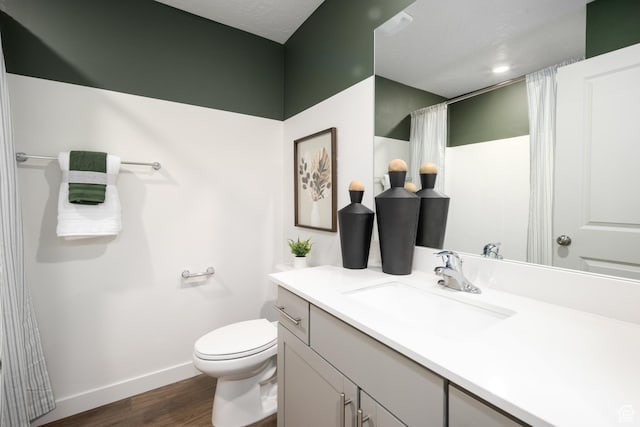 2476 N Wildwood Ln E Unit 249, Heber City, UT 84032 - full bath with vanity, wood finished floors, toilet, baseboards, and a shower with curtain