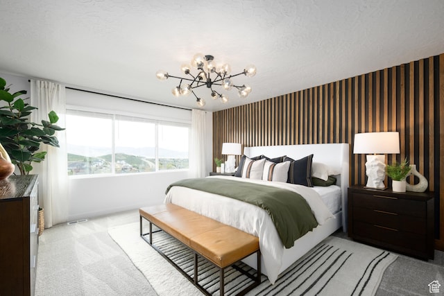 2476 N Wildwood Ln E Unit 249, Heber City, UT 84032 - bedroom with light colored carpet, a chandelier, baseboards, and a textured ceiling