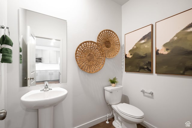 2476 N Wildwood Ln E Unit 249, Heber City, UT 84032 - half bathroom with baseboards, toilet, and wood finished floors