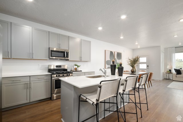 2476 N Wildwood Ln E Unit 249, Heber City, UT 84032 - kitchen with stainless steel appliances, a sink, gray cabinets, dark wood-style flooring, and recessed lighting