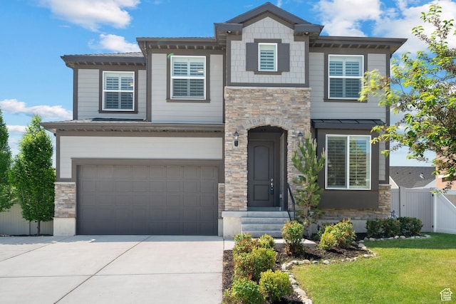 296 E 12025th St S, Draper, UT 84020 - view of front of home with stone siding, a garage, and concrete driveway