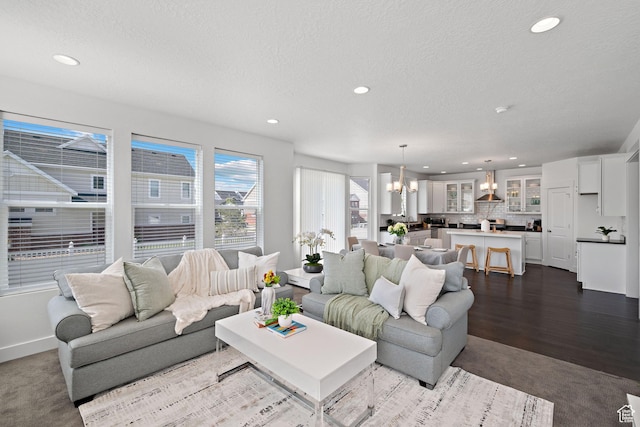 296 E 12025th St S, Draper, UT 84020 - living area featuring a chandelier, a textured ceiling, recessed lighting, baseboards, and dark carpet