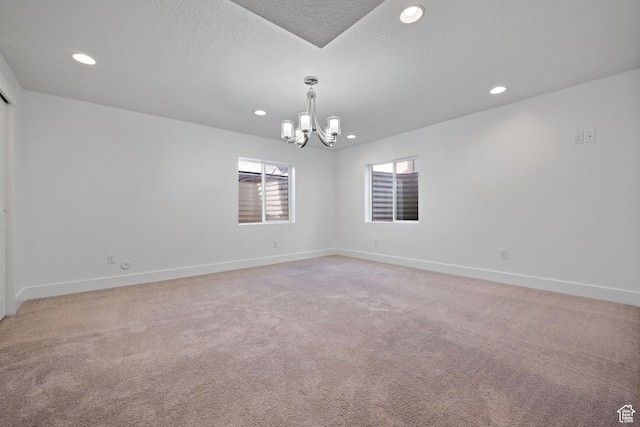 296 E 12025th St S, Draper, UT 84020 - spare room with a chandelier, recessed lighting, baseboards, light carpet, and a textured ceiling
