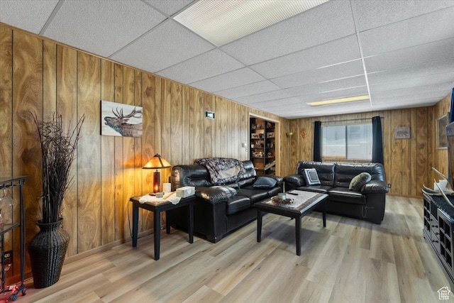 12525 S 1300 E, Draper, UT 84020 - living room with a drop ceiling, wood walls, and light wood finished floors