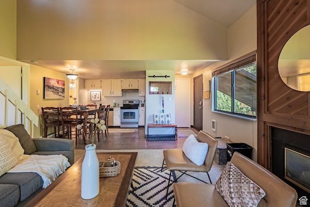 2025 Canyon Resort Dr Unit L-5, Park City, UT 84098 - living area featuring high vaulted ceiling, dark wood-style flooring, and a fireplace