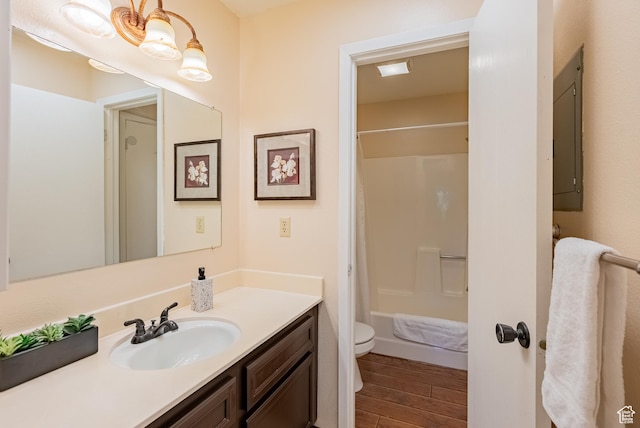 2025 Canyon Resort Dr Unit L-5, Park City, UT 84098 - bathroom with toilet, vanity, wood finished floors, and shower / tub combo with curtain