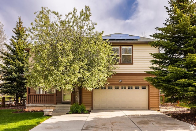 1189 E Fox Crest Dr, Park City, UT 84098 - obstructed view of property with a garage, solar panels, driveway, and covered porch