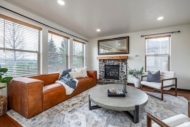 1189 E Fox Crest Dr, Park City, UT 84098 - living room featuring a stone fireplace, wood finished floors, and recessed lighting