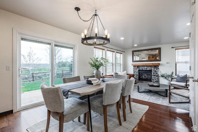 1189 E Fox Crest Dr, Park City, UT 84098 - dining area featuring healthy amount of natural light, a chandelier, dark wood-style flooring, a fireplace, and recessed lighting