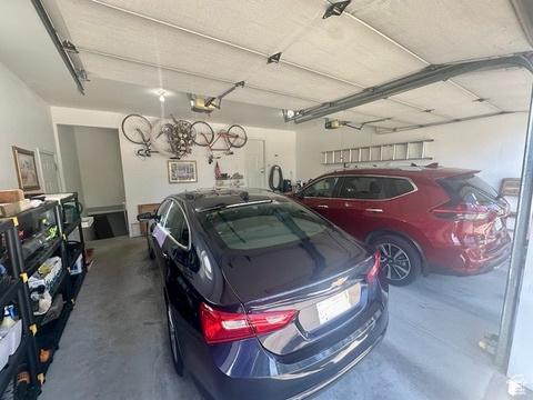 341 E Wilford Ave, Murray, UT 84107 - garage featuring a garage door opener