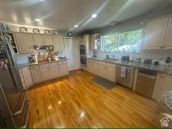 341 E Wilford Ave, Murray, UT 84107 - kitchen featuring stainless steel appliances, a sink, light wood-style flooring, and under cabinet range hood