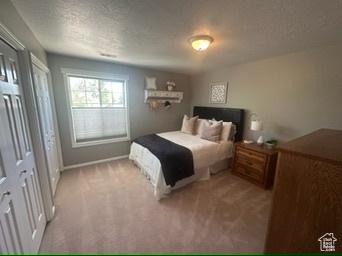 341 E Wilford Ave, Murray, UT 84107 - bedroom with light colored carpet and baseboards