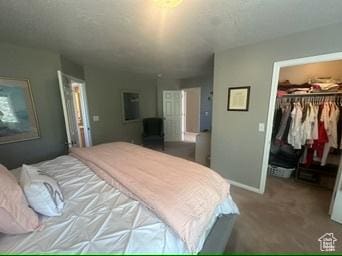 341 E Wilford Ave, Murray, UT 84107 - bedroom featuring a spacious closet, a closet, carpet floors, and baseboards