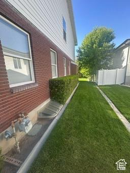 341 E Wilford Ave, Murray, UT 84107 - view of side of home with brick siding