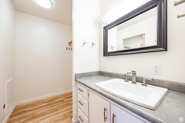 2006 E Creek Rd, Sandy, UT 84093 - bathroom featuring wood finished floors, vanity, and baseboards