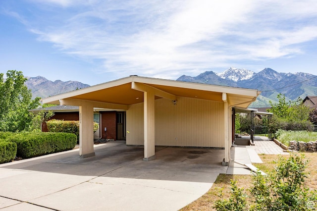 2006 E Creek Rd, Sandy, UT 84093 - view of front of house featuring a mountain view, an attached carport, and driveway