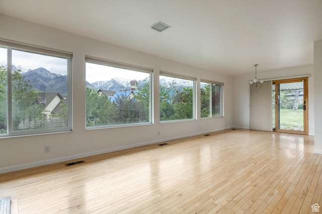 2006 E Creek Rd, Sandy, UT 84093 - spare room with baseboards, light wood finished floors, and a mountain view