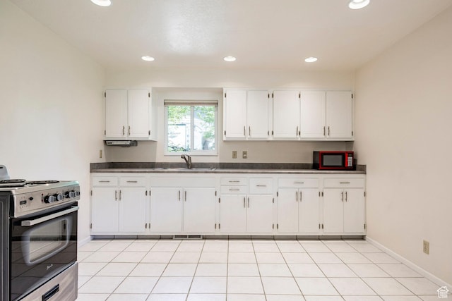 2006 E Creek Rd, Sandy, UT 84093 - kitchen featuring electric range, a sink, dark countertops, white cabinets, and recessed lighting
