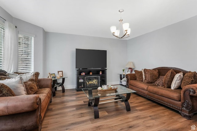 1107 N Independence Ave W, Provo, UT 84604 - living area featuring wood finished floors, a chandelier, baseboards, and a glass covered fireplace