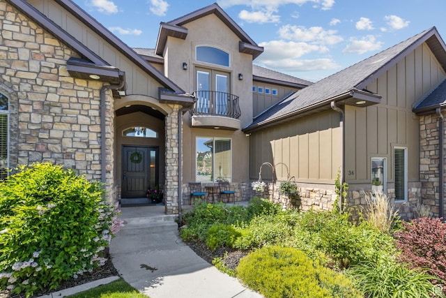 36 E 1450 N, Lehi, UT 84043 - doorway to property with stone siding, a balcony, board and batten siding, and a shingled roof