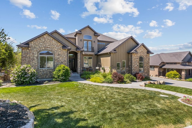 36 E 1450 N, Lehi, UT 84043 - view of front of home with board and batten siding, stone siding, a front lawn, and a balcony