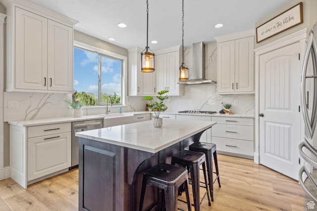 36 E 1450 N, Lehi, UT 84043 - kitchen with wall chimney exhaust hood, appliances with stainless steel finishes, white cabinetry, backsplash, and recessed lighting