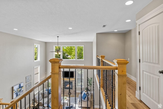 36 E 1450 N, Lehi, UT 84043 - hall with an upstairs landing, recessed lighting, wood finished floors, baseboards, and a textured ceiling