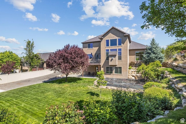 36 E 1450 N, Lehi, UT 84043 - rear view of house with stucco siding and a patio