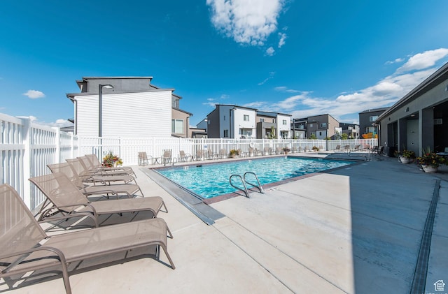 5288 W Solafax Ln Unit 34-1, Herriman, UT 84096 - community pool with a patio area and a residential view